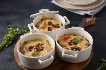 Julienne with chicken and mushrooms with a golden crust ,  baked cheese