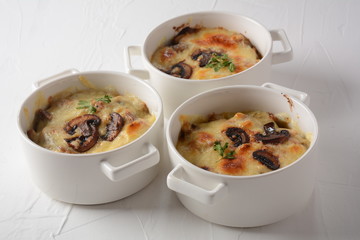 Julienne with chicken and mushrooms with a golden crust ,  baked cheese