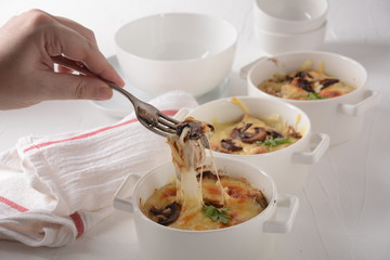Julienne with chicken and mushrooms with a golden crust ,  baked cheese
