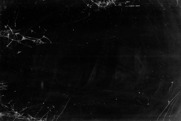 Broken glass texture. Cracked screen. Black fractured laptop display overlay with dust scratches.