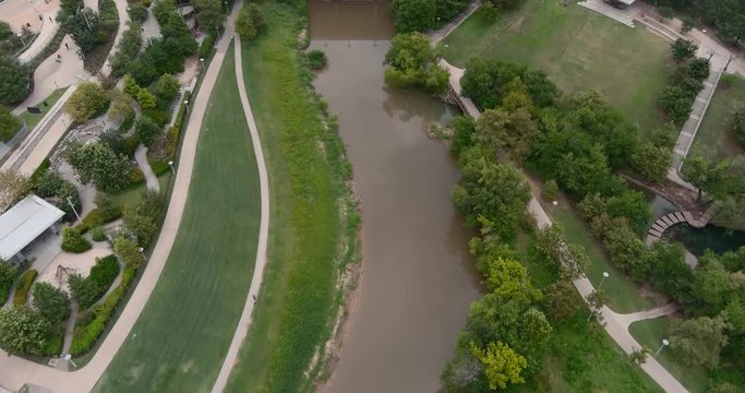 Aerial view of the Buffalo Bayou that runs throughout all of Houston. This video was film in 6k and down scaled to 4k for best image quality.