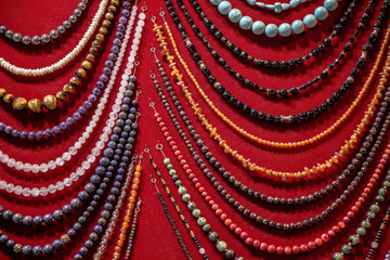 Closeup shot of hanging beaded necklaces at a market