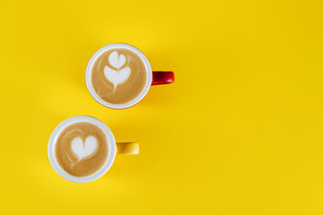 Top view image of coffee cup on yellow background. Flat lay. Copy space