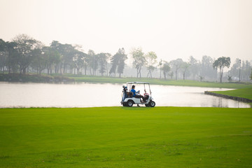 Golfers are about to play golf on bright green grass