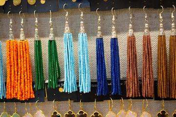 Closeup shot of colorful hanging beaded necklaces