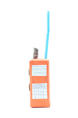 Invention of radio communication device or walkie talkie, toys from from milk boxes, paper, crayons and plastic tubes isolated on white background.