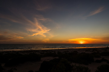 Fototapeta na wymiar Sunset at La Barrosa beach in Sancti Petri, Cadiz, Spain