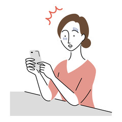 スマホを見てショックを受ける女性
