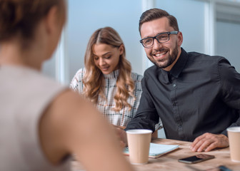 business team discussing business issues over a Cup of coffee