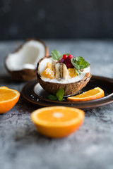 Smoothie bowl with colorful tropical fruits. Summer healthy diet, vegan breakfast.
