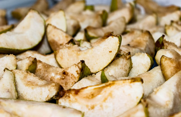 Dried up slices of pear before drying.