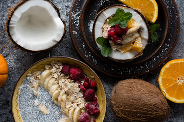 Smoothie bowl with colorful tropical fruits. Summer healthy diet, vegan breakfast.