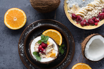 Smoothie bowl with colorful tropical fruits. Summer healthy diet, vegan breakfast.