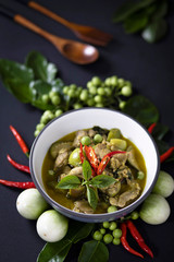 
Chicken Green Curry It is a popular Thai food. Placed on a black wooden table.