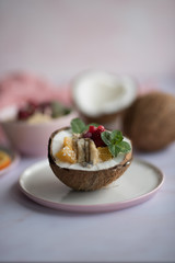 Smoothie bowl with colorful tropical fruits. Summer healthy diet, vegan breakfast.
