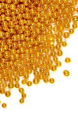 Small balls of gold on a white background.