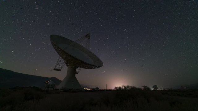 Time lapse tracking shot of Comet Neowise through radio observatory in Eastern Sierra, California