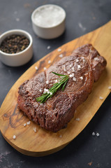 Grilled steak on cutting board
