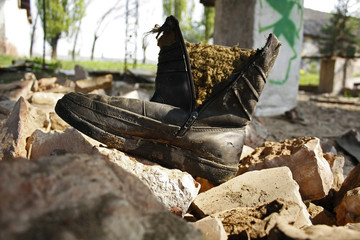 Closeup shot of an old shoe on the rocks