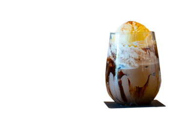 A glass of ice chocolate drink with whipping cream and icecream. A refreshment drink and dessert to...