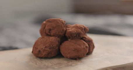 handmade chocolate truffles on a wood board