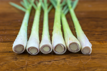 Lemongrass on a wooden backdrop. Lemongrass is a kind of spice.