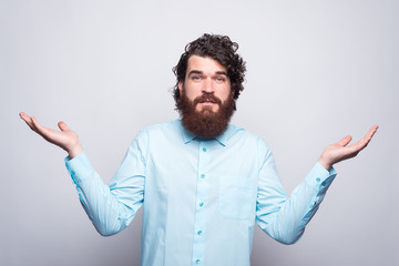 Dont know what to do in this case, photo of confused bearded man in casual.