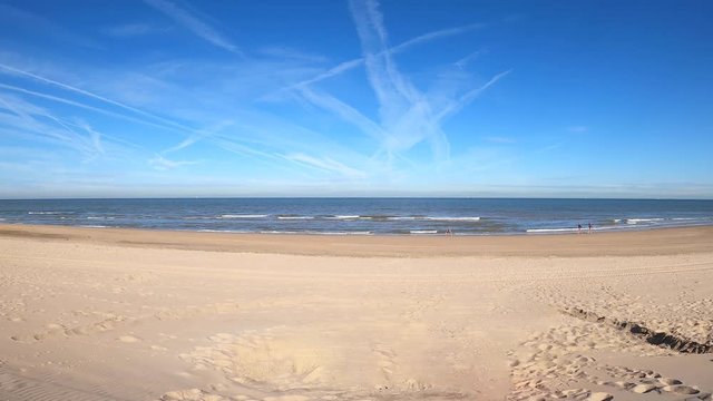 Timelapse of people enjoying the beach on a Sunny summer day in Noordwijk, the Netherlands