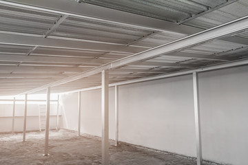 under metal sheet roof corrugated metallic texture surface in new construction.