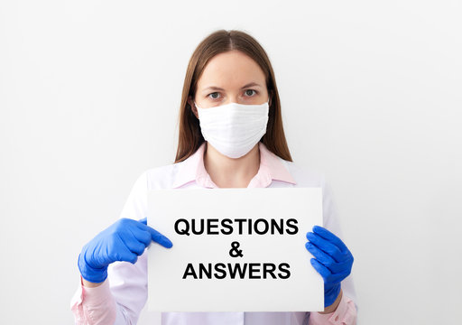 Q and A text word inscription acronym on paperin hands of doctor. medical questions and answers concept