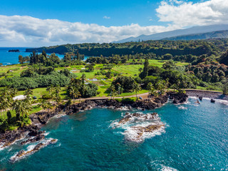 Marvelous shore. Large boulder among the waves in the sea. Hawaii 