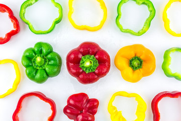 Sweet pepper on a white background./ Three colorful fresh yellow, red, green sweet pepper.