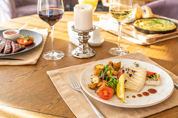 fried squid with grilled vegetables on a served table. served table with dishes.