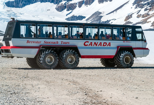 Alberta, Canada - May 30 2007: Massive Ice Explorer take tourists onto the the Athabasca Glacier in the Columbia Icefields in spring