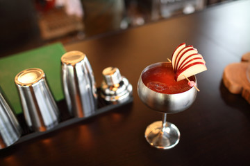 cocktails in glasses on bar counter in pup or restaurant