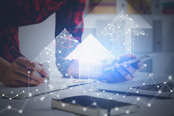 Woman hand writing, financial graph