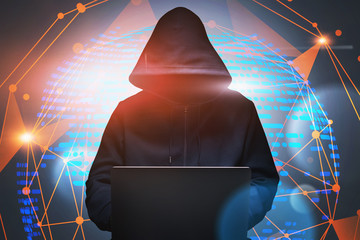 Unrecognizable hacker using laptop, network