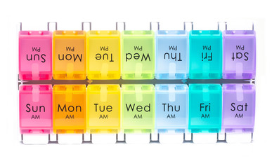 Colourful daily pill dispenser box on a white background