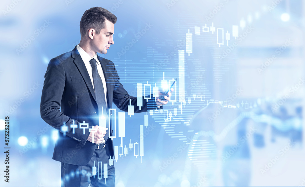 Poster trader with smartphone in office, graph