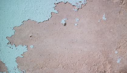 Weathered wall cracking and peeling the color paint, old concrete wall surface, abstract texture for background.
