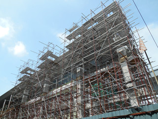 SERDANG, MALAYSIA -JUNE 13, 2016: Construction site in progress at Serdang, Malaysia during the daytime. Workers busy with their task installing formwork and reinforcement bar.    