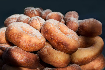 Deep fried donut with powdered sugar, background