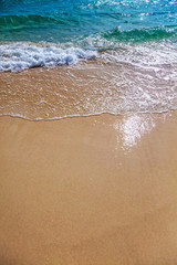 Fototapeta na wymiar Sand beach and sea waves