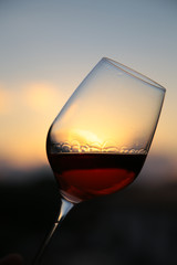 beautiful sunset with a glass of italian red wine