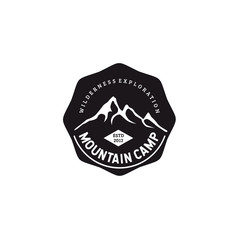 Black hexagon logo vector illustration of mountain silhouette with simple typography isolated on white background fit for outdoor adventure business logo or t shirt design 