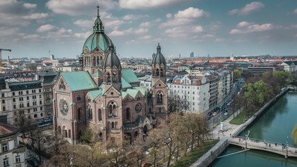 Aerial view of St. Lukas church and in the background Munich City in Bavaria, Germany.