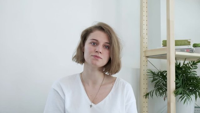 Mindblown reaction of upset girl expressing shock, anger. young caucasian woman in shocking situation, gesture of mind blown. She never expected this, she is surprised, dissatisfied, disappointed