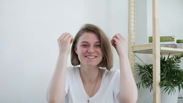 Mindblown reaction of millennial girl expressing astonishment, thrilling excitement. young caucasian woman in shocking situation, gesture of mind blown. She never expected this and she is surprised