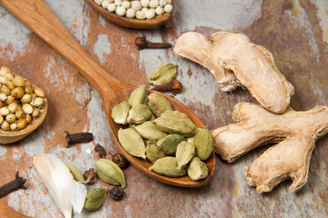 Aromatic spices on wooden spoons. Food ingradients.



