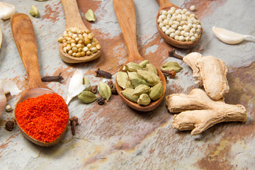 Aromatic spices on wooden spoons. Food ingradients.


